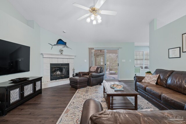 10738 Magnolia Ln, Lillian, AL 36549 - living area with a tile fireplace, dark wood-type flooring, ceiling fan, and vaulted ceiling