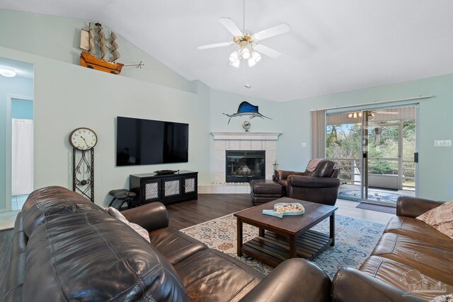 10738 Magnolia Ln, Lillian, AL 36549 - living room featuring a fireplace, vaulted ceiling, wood finished floors, and a ceiling fan