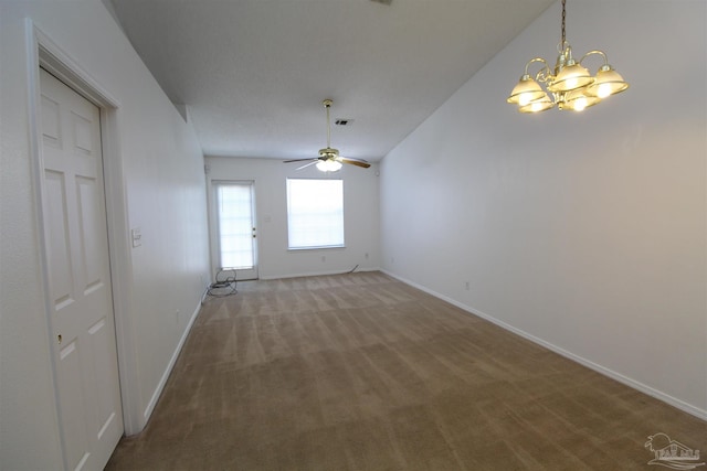 interior space with ceiling fan with notable chandelier, lofted ceiling, and carpet