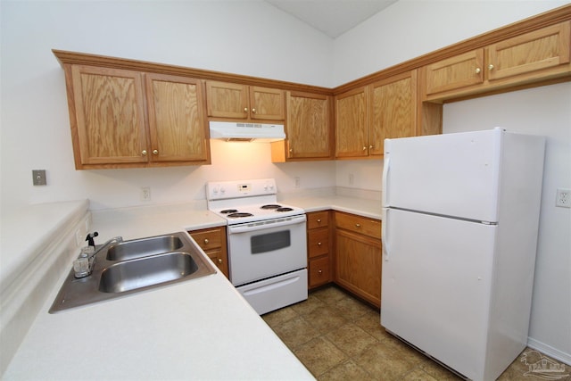 kitchen featuring white appliances and sink