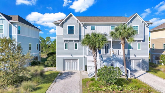 view of front of home featuring a porch and a garage