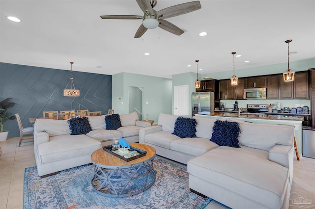 living room with light tile patterned floors and ceiling fan