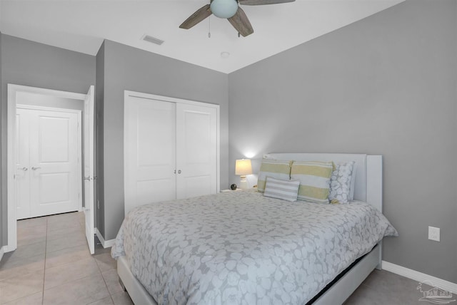 tiled bedroom featuring a closet and ceiling fan