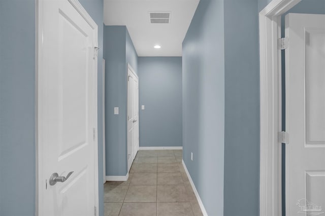 hallway featuring light tile patterned floors