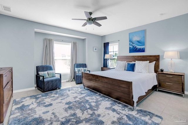 bedroom featuring light tile patterned flooring and ceiling fan