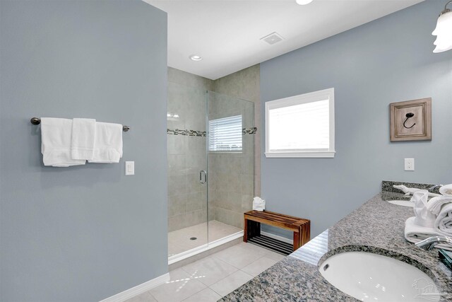 bathroom with vanity, tile patterned floors, and a shower with shower door