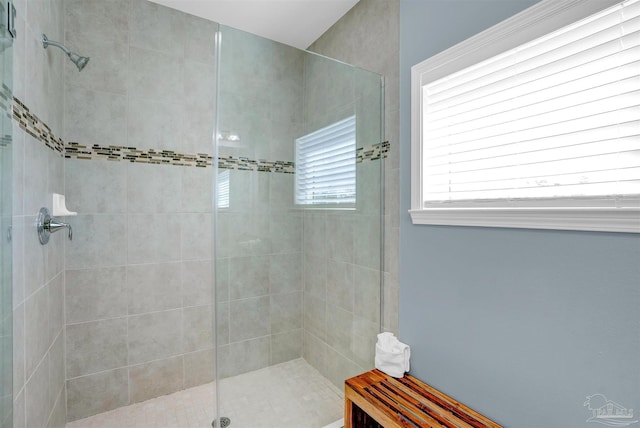 bathroom featuring a tile shower