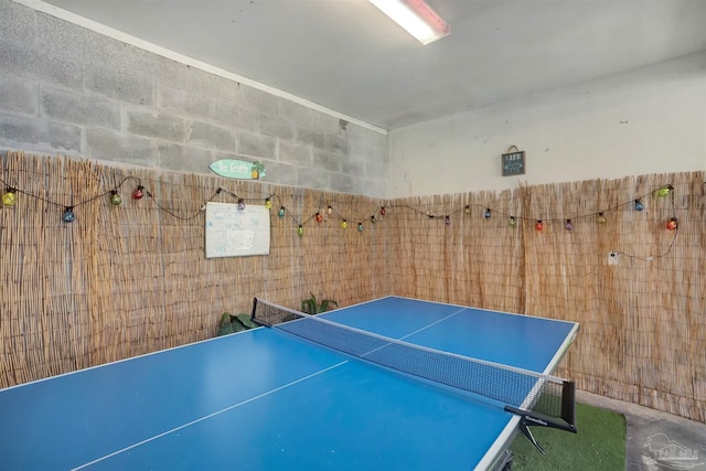 game room featuring concrete floors