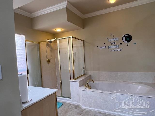 bathroom with vanity, crown molding, tile patterned floors, and shower with separate bathtub