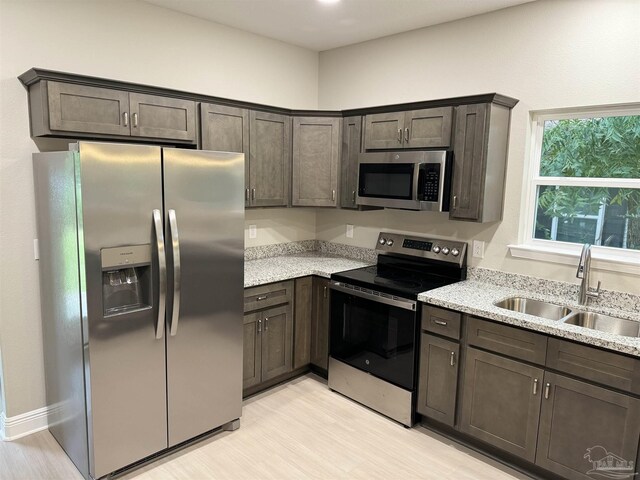 utility room featuring water heater