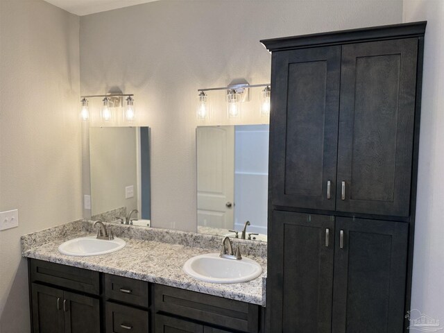 kitchen featuring gray cabinetry, stainless steel appliances, and light hardwood / wood-style flooring