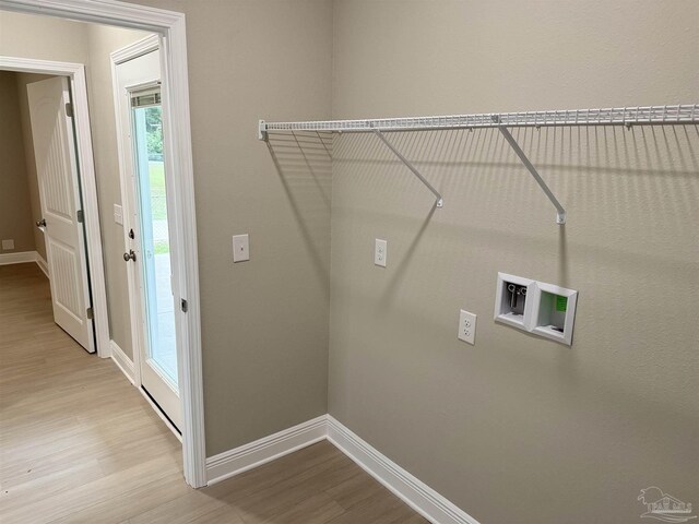 empty room with ceiling fan and light hardwood / wood-style flooring