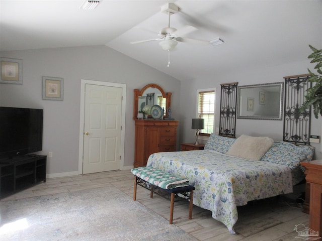 bedroom featuring ceiling fan, lofted ceiling, and light hardwood / wood-style floors