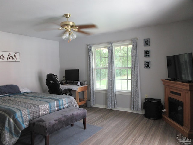 bedroom featuring wood-type flooring and ceiling fan