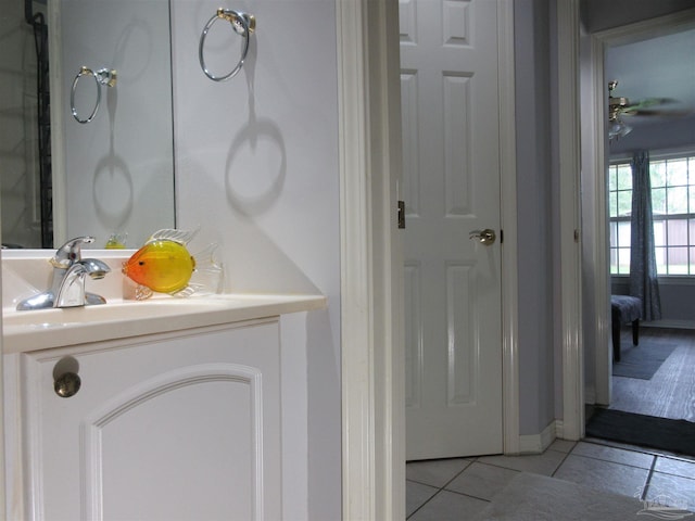 bathroom with tile patterned flooring and vanity