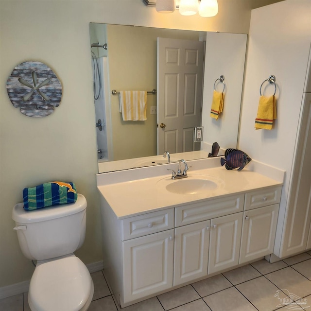 bathroom featuring vanity, toilet, and tile patterned flooring