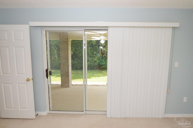 doorway with light colored carpet