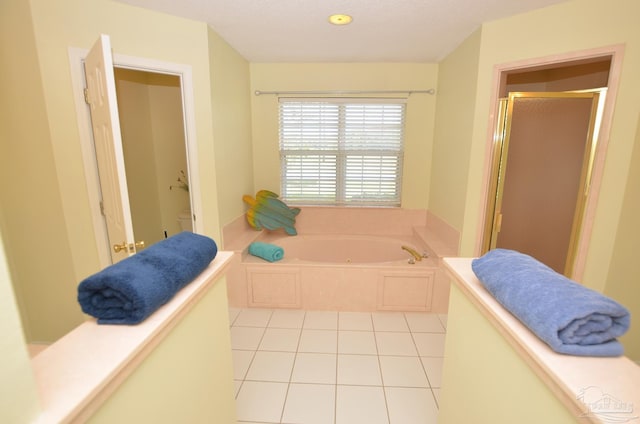 bathroom featuring separate shower and tub and tile patterned flooring