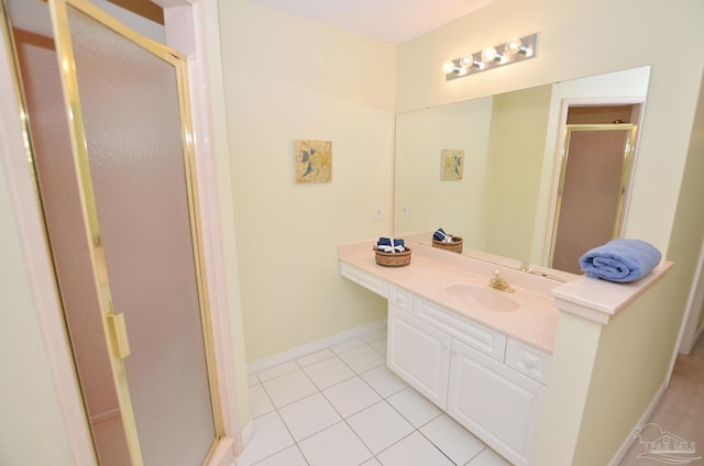 bathroom featuring vanity, tile patterned floors, and walk in shower