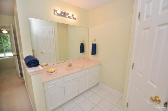 bathroom with tile patterned floors and vanity