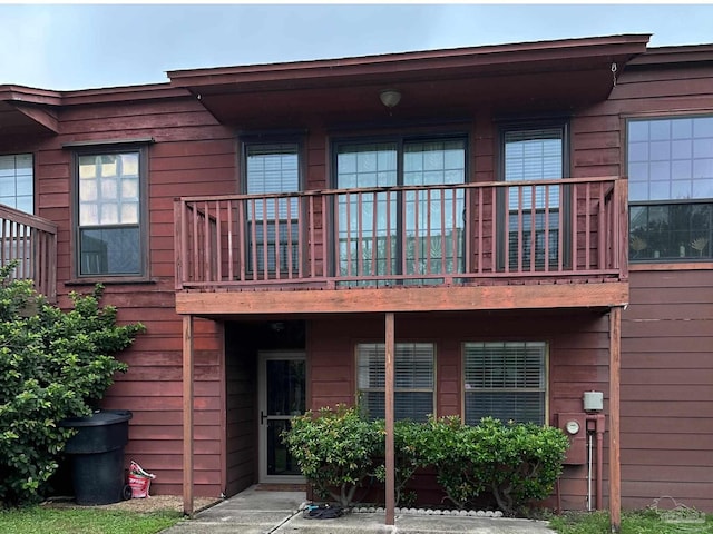 rear view of house with a balcony