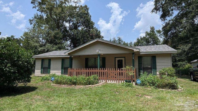 ranch-style home with a front lawn and covered porch