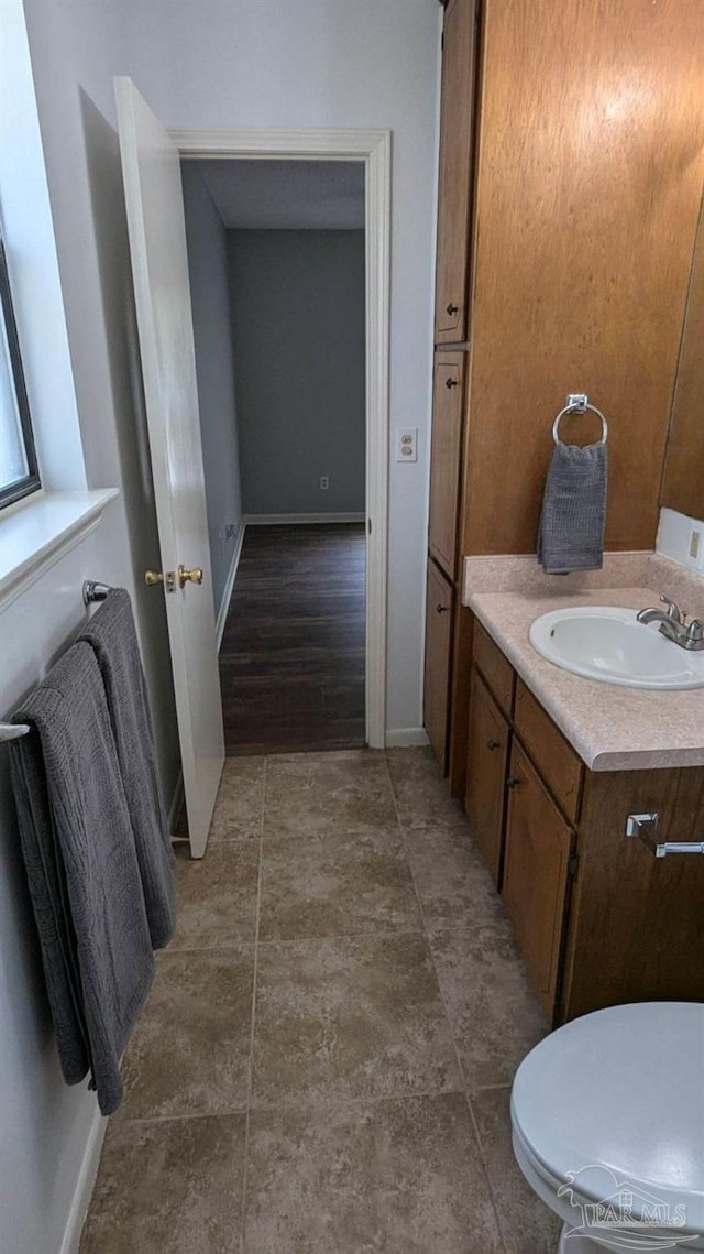 bathroom with vanity and toilet