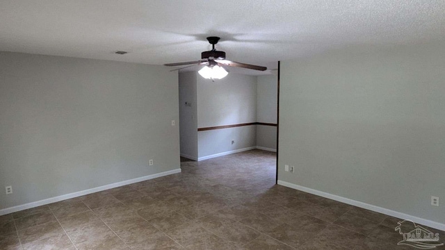 spare room with ceiling fan