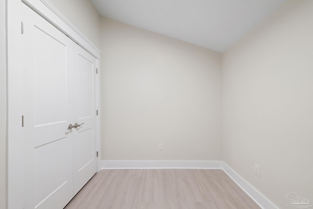 spare room featuring light wood-style flooring and baseboards