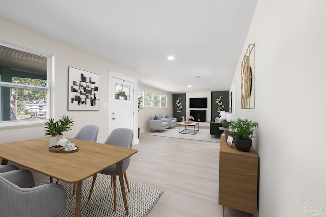 dining room with recessed lighting and light wood finished floors