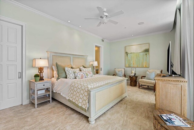 carpeted bedroom featuring ceiling fan and crown molding