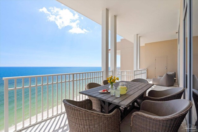 balcony with a beach view and a water view