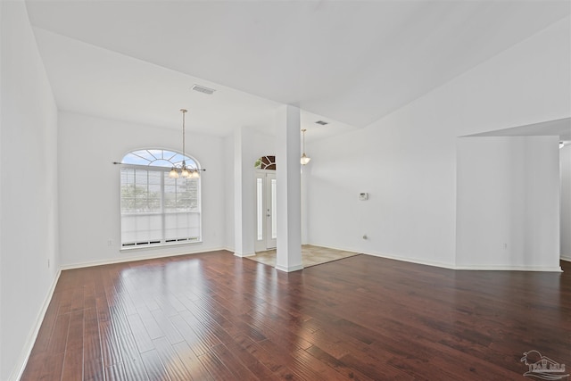 4810 Endeavor Ct, Milton, FL 32570 - unfurnished living room featuring a chandelier, wood finished floors, and baseboards