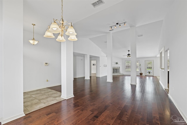 4810 Endeavor Ct, Milton, FL 32570 - unfurnished living room with wood finished floors, high vaulted ceiling, decorative columns, a chandelier, and track lighting