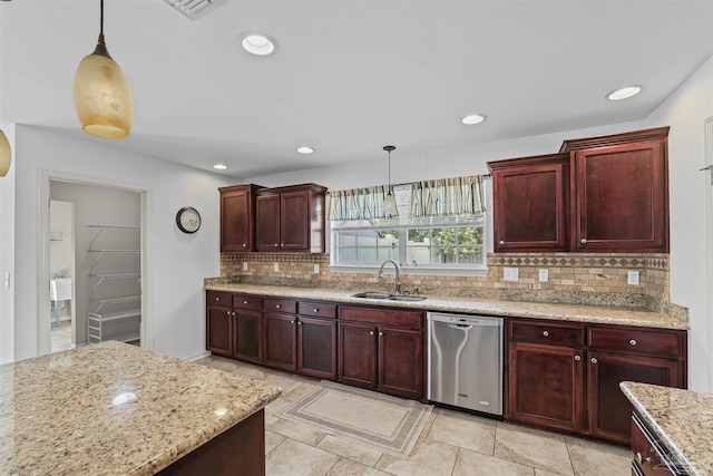 4810 Endeavor Ct, Milton, FL 32570 - kitchen featuring dishwasher, a sink, dark brown cabinets, hanging light fixtures, and decorative backsplash