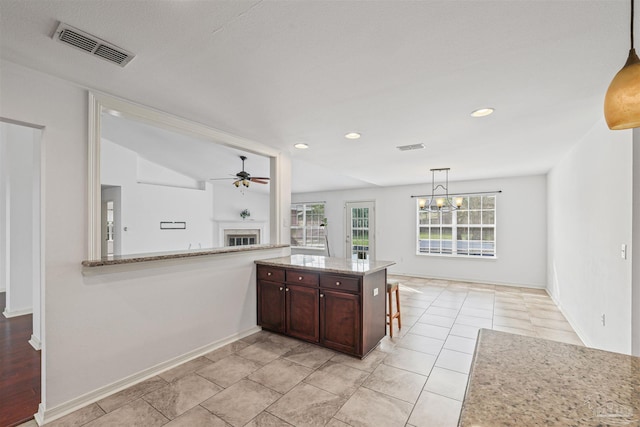4810 Endeavor Ct, Milton, FL 32570 - kitchen with a fireplace, ceiling fan, a chandelier, recessed lighting, and decorative light fixtures