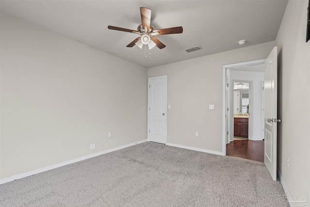 4810 Endeavor Ct, Milton, FL 32570 - unfurnished bedroom with dark colored carpet, baseboards, and ceiling fan