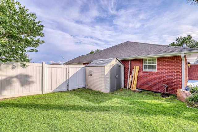 4810 Endeavor Ct, Milton, FL 32570 - back of house with a gate, brick siding, and roof with shingles