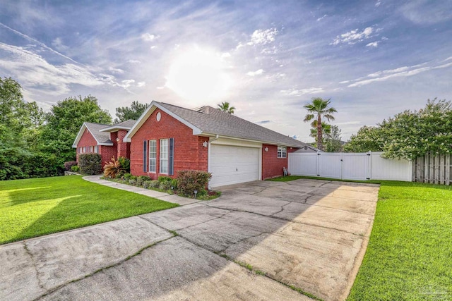 4810 Endeavor Ct, Milton, FL 32570 - view of front of house with a gate, brick siding, concrete driveway, a garage, and roof with shingles