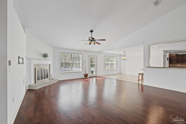 4810 Endeavor Ct, Milton, FL 32570 - unfurnished living room featuring lofted ceiling, a ceiling fan, a premium fireplace, baseboards, and wood finished floors