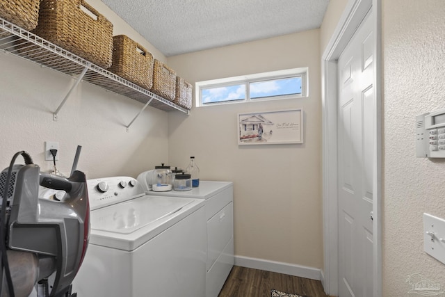 5576 Shadow Shore Pl, Gulf Breeze, FL 32563 - washroom featuring washer and dryer, dark wood finished floors, and a textured ceiling