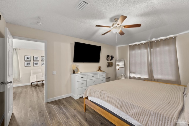5576 Shadow Shore Pl, Gulf Breeze, FL 32563 - bedroom with light wood-type flooring, a textured ceiling, and a ceiling fan