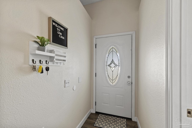 5576 Shadow Shore Pl, Gulf Breeze, FL 32563 - doorway to outside with dark wood-type flooring and baseboards