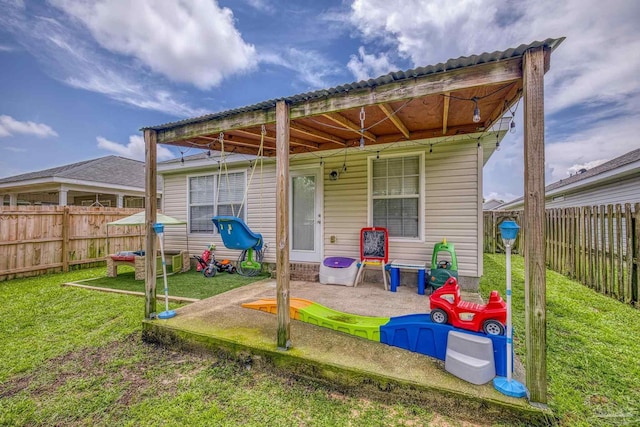 5576 Shadow Shore Pl, Gulf Breeze, FL 32563 - back of property with a fenced backyard and a patio