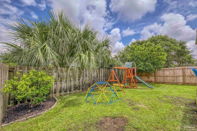 5576 Shadow Shore Pl, Gulf Breeze, FL 32563 - fenced backyard with a playground