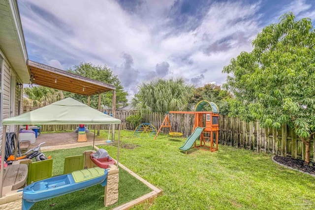 5576 Shadow Shore Pl, Gulf Breeze, FL 32563 - fenced backyard featuring a playground and a gazebo