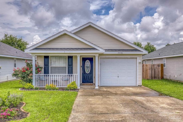 5576 Shadow Shore Pl, Gulf Breeze, FL 32563 - single story home with concrete driveway, a porch, and a garage