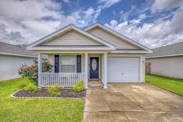 5576 Shadow Shore Pl, Gulf Breeze, FL 32563 - view of front of house featuring a porch, driveway, a garage, and a front yard