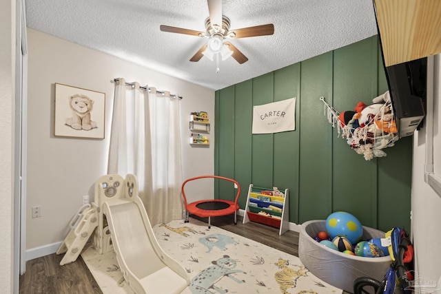 5576 Shadow Shore Pl, Gulf Breeze, FL 32563 - game room featuring dark wood-style floors, ceiling fan, and a textured ceiling