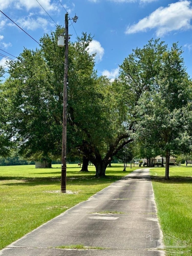 view of community featuring a yard